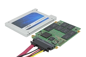 Technician conducting SSD data recovery with specialized software and tools