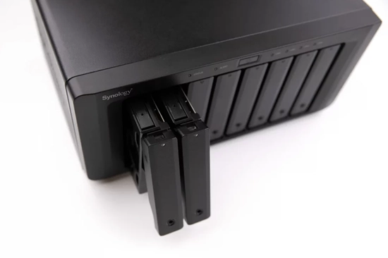 Synology NAS unit with a compact, sleek design and multiple drive bays.