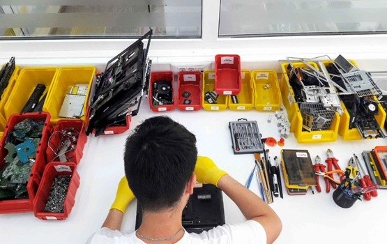 Technician Performing Data Recovery with Organized Workbench