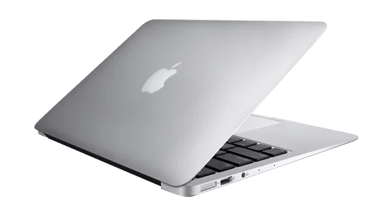 Close-up of a Mac laptop, with a sleek design, illuminated Apple logo