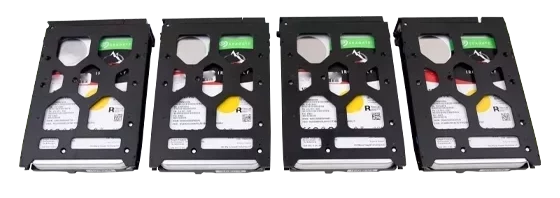 Four Seagate IronWolf hard drives in protective enclosures aligned side by side