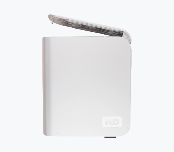 A white Western Digital (WD) external storage device with its top cover partially open.